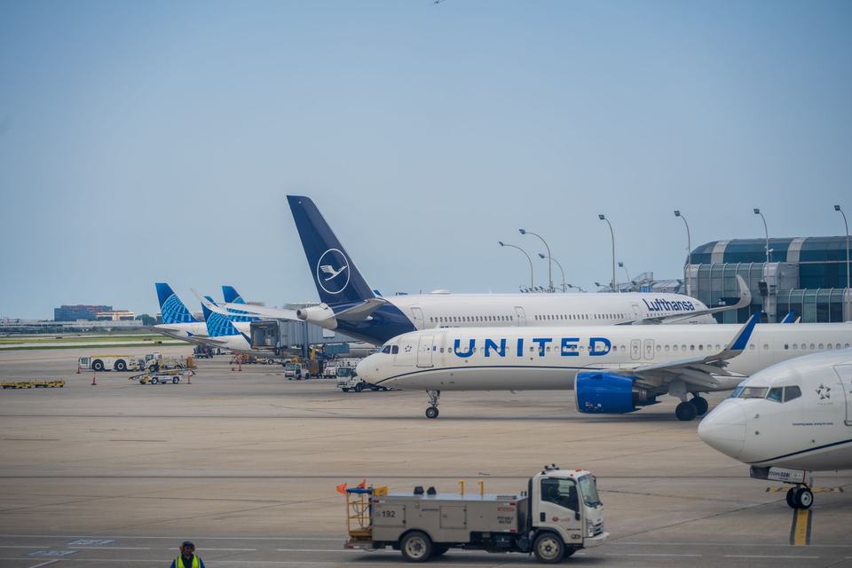 Airplanes at the airport terminal and runway