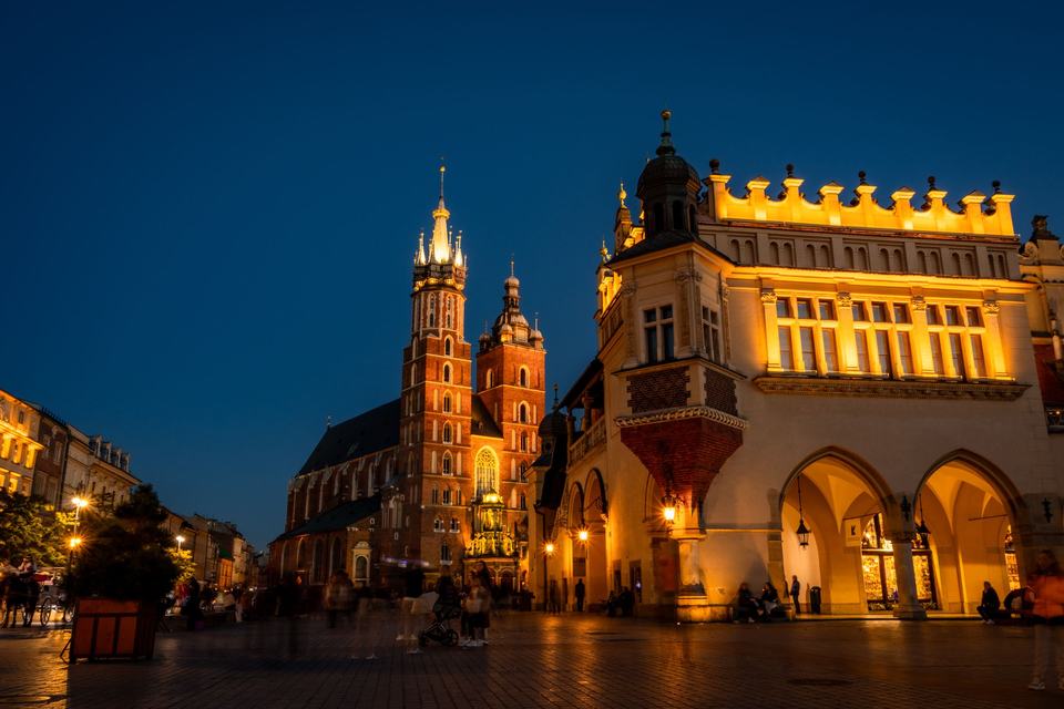 Evening illumination of St. Mary's Church and Cloth Hall in Krakow (Kraków)