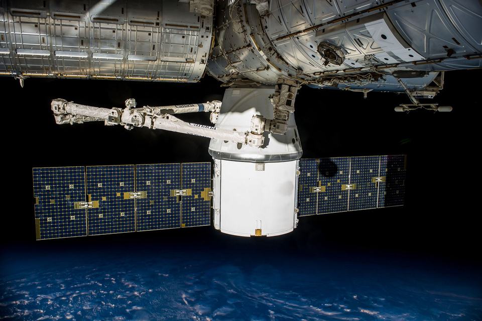 Spacecraft with solar panels in Earth orbit
