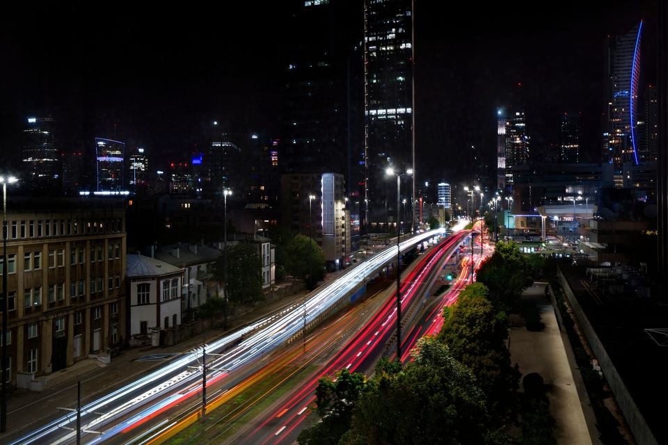 Night Warsaw (Warszawa): city lights and light trails of transport
